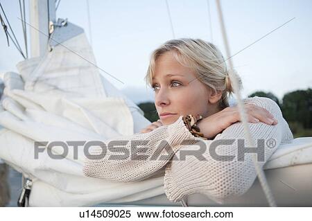Girl laying on sail View Large Photo Image Stock Photography - Girl laying on sail. Fotosearch