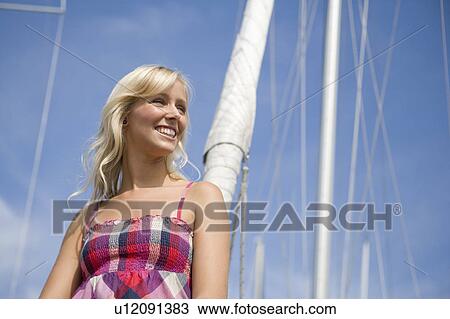 Girl sitting on boat View Large Photo Image Stock Image - Girl sitting on boat. Fotosearch