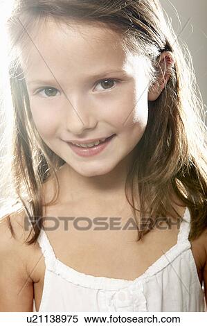 Stock Photography - Girl smiling at camera. Fotosearch