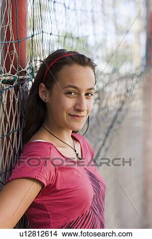 Girl smiling to the camera on View Large Photo Image Picture - Girl smiling to the camera on. Fotosearch