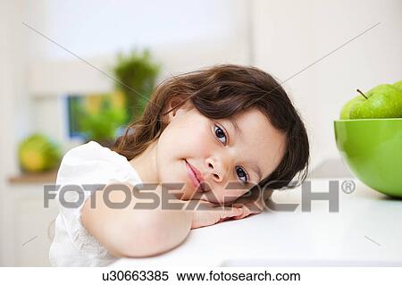 Girl smiling with green apples View Large Photo Image Stock Photography - Girl smiling with green apples. Fotosearch