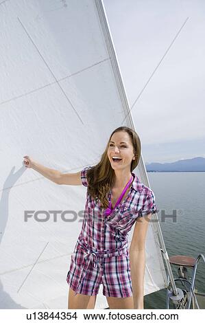 Girl standing on boat View Large Photo Image Picture - Girl standing on boat. Fotosearch