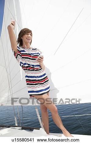 Girl standing on boat View Large Photo Image Stock Image - Girl standing on boat. Fotosearch