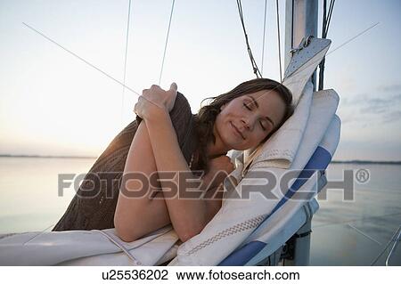Girl standing on sail View Large Photo Image Stock Image - Girl standing on sail. Fotosearch