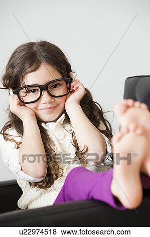 Girl with adult glasses View Large Photo Image Stock Photo - Girl with adult glasses. Fotosearch