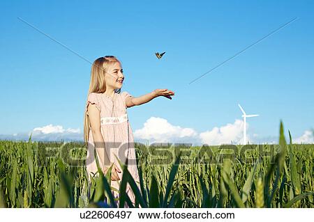 Girl with butterfly View Large Photo Image Stock Photo - Girl with butterfly. Fotosearch