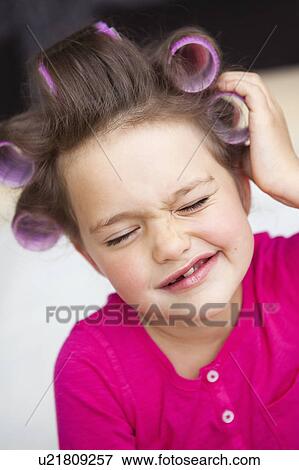 Girl with hair curlers View Large Photo Image Stock Photo - Girl with hair curlers. Fotosearch