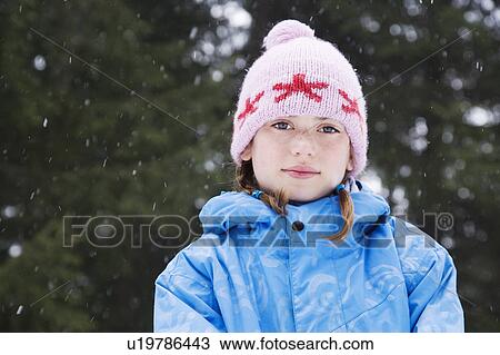 Stock Image - Girl with wooly hat smiling. Fotosearch