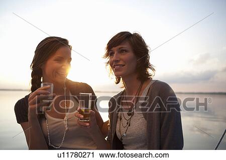 Girls drinking beer View Large Photo Image Stock Image - Girls drinking beer. Fotosearch