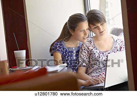 Girls hanging out in a cafe View Large Photo Image Stock Image - Girls hanging out in a cafe. Fotosearch