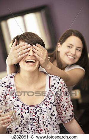 Stock Photo - Girls hanging out in cafe. Fotosearch