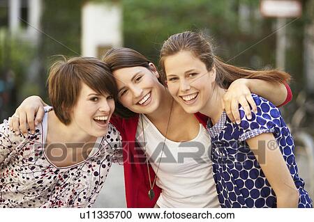 Girls together in a courtyard View Large Photo Image Stock Image - Girls together in a courtyard. Fotosearch