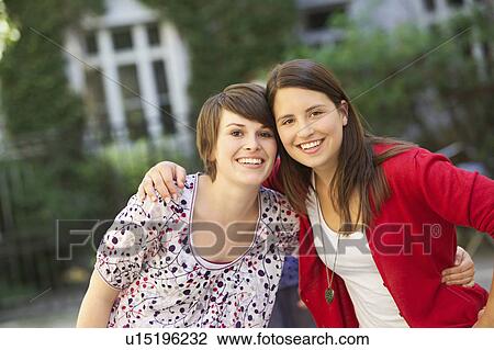Girls together in a courtyard View Large Photo Image Stock Image - Girls together in a courtyard. Fotosearch