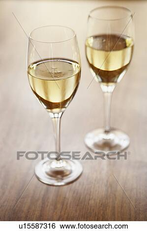 Glasses of white wine View Large Photo Image Stock Photograph - Glasses of white wine. Fotosearch