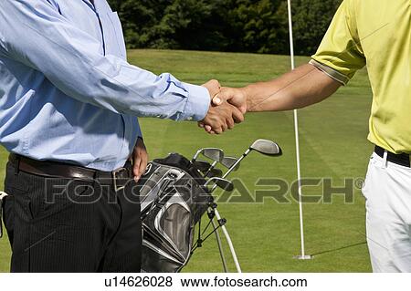 Golfer and caddy shaking hands View Large Photo Image Stock Photo - Golfer and caddy shaking hands. Fotosearch
