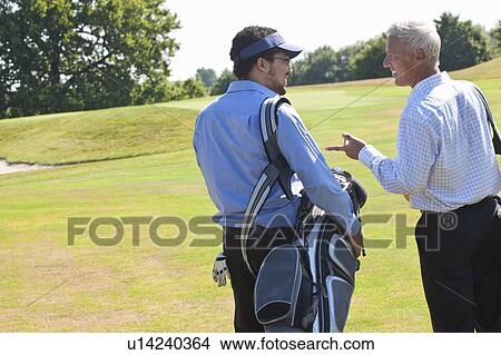 Golfers talking during the game View Large Photo Image Picture - Golfers talking during the game. Fotosearch