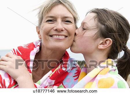 Granddaughter kisses grandmother View Large Photo Image Stock Photograph - Granddaughter kisses grandmother. Fotosearch