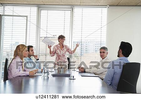Stock Image - Group of business people in meeting. Fotosearch