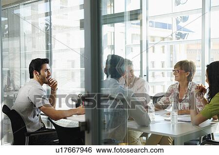 Group of people having a casual meeting View Large Photo Image Stock Photograph - Group of people having a casual meeting. Fotosearch