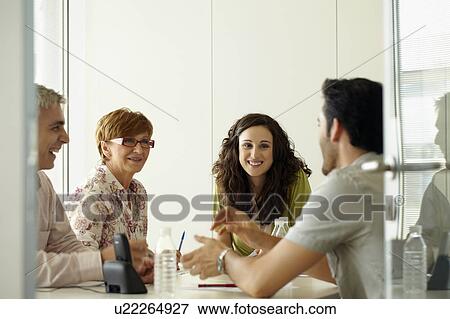 Stock Photo - Group of people in a positive meeting. Fotosearch