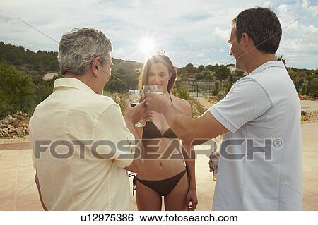 Group of people toasting each other View Large Photo Image Stock Photograph - Group of people toasting each other. Fotosearch