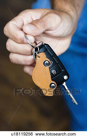 Hand holding car keys View Large Photo Image Stock Photograph - Hand holding car keys. Fotosearch