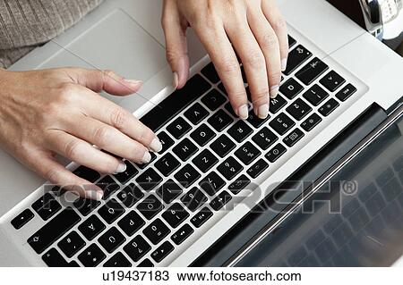 Hands typing on laptop View Large Photo Image Stock Image - Hands typing on laptop. Fotosearch