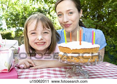 Happy little girl at birthday party View Large Photo Image Stock Image - Happy little girl at birthday party. Fotosearch