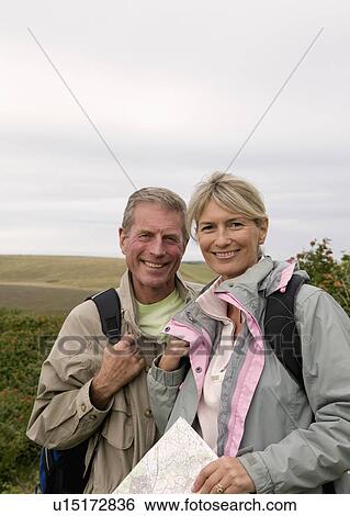 Stock Photograph - Happy seniors in countryside. Fotosearch