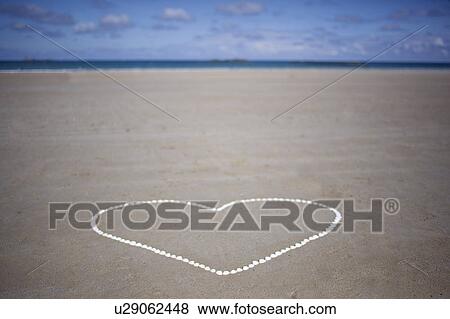 Heart made with shells View Large Photo Image Stock Photo - Heart made with shells. Fotosearch