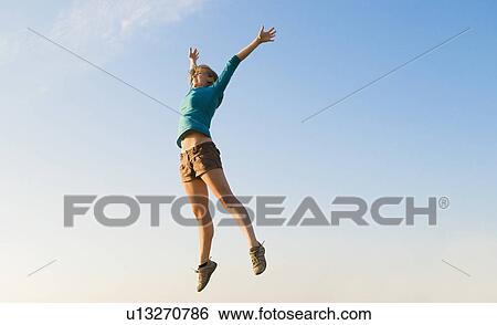 Hiker jumps in celebration View Large Photo Image Stock Photograph - Hiker jumps in celebration. Fotosearch