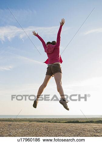 Hiker jumps View Large Photo Image Stock Photograph - Hiker jumps. Fotosearch
