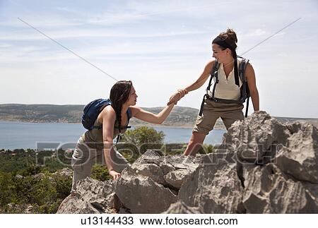 Hikers on coastal path View Large Photo Image Stock Image - Hikers on coastal path. Fotosearch