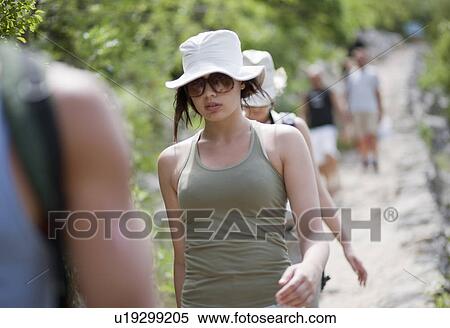 Stock Photography - Hikers on coastal path. Fotosearch