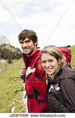 Stock Photo - Hiking couple looking to camera. Fotosearch