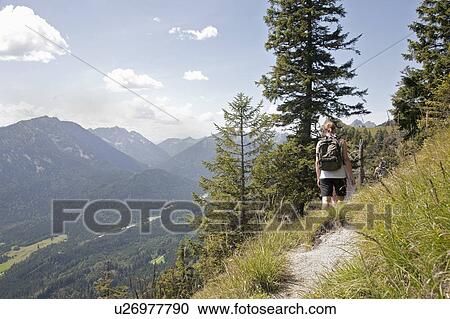 Hiking the trails through the mountains View Large Photo Image Stock Image - Hiking the trails through the mountains. Fotosearch