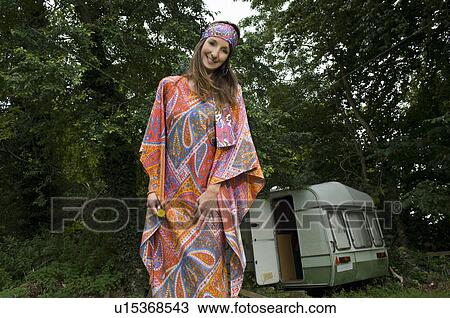 Stock Image - Hippy female by caravan. Fotosearch