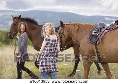 Stock Image - Horse riding trip. Fotosearch