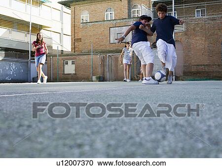 Kids playing soccer toghether View Large Photo Image Stock Image - Kids playing soccer toghether. Fotosearch