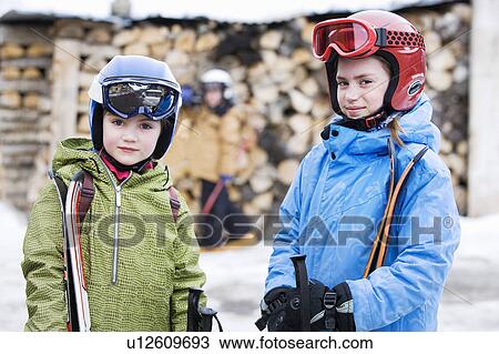 Kids with Skis by log pile View Large Photo Image Stock Image - Kids with Skis by log pile. Fotosearch