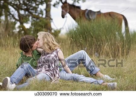 Kissing couple View Large Photo Image Stock Image - Kissing couple. Fotosearch
