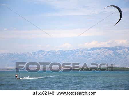 Kitesurfer speeding View Large Photo Image Stock Photo - Kitesurfer speeding. Fotosearch