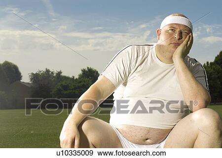 Large man looking fed up View Large Photo Image Stock Photo - Large man looking fed up. Fotosearch