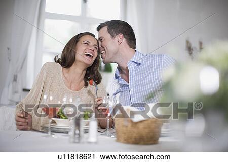 Stock Image - Laughing couple. Fotosearch