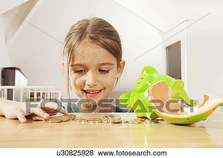 Little girl counting money View Large Photo Image Stock Photo - Little girl counting money. Fotosearch