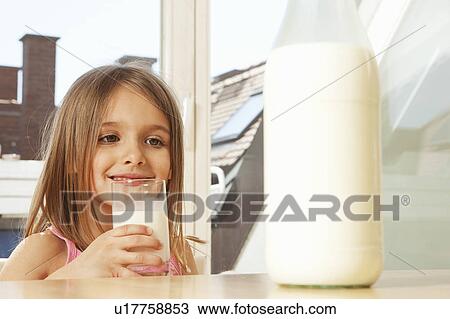 Little Girl drinking milk View Large Photo Image Stock Image - Little Girl drinking milk. Fotosearch