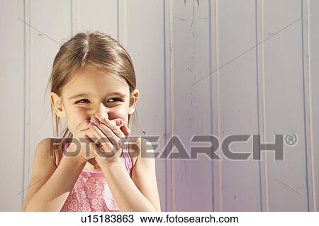 Stock Image - Little Girl giggling. Fotosearch