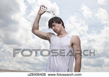 Male runner pouring water over head View Large Photo Image Stock Photo - Male runner pouring water over head. Fotosearch