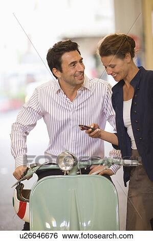 Man and woman in the city View Large Photo Image Stock Photograph - Man and woman in the city. Fotosearch