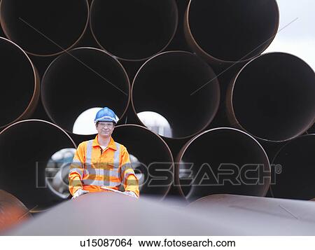 Man checking pipes View Large Photo Image Picture - Man checking pipes. Fotosearch